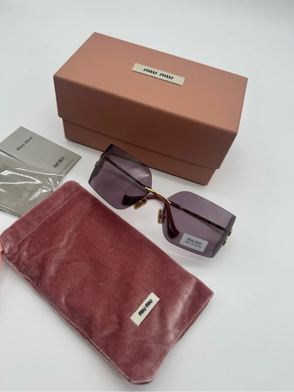 Miu Miu Purple Rimless Sunglasses with Gold Accents